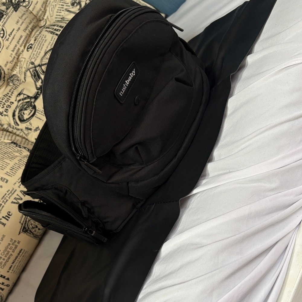 Tushbaby hip carrier and diaper changing mat